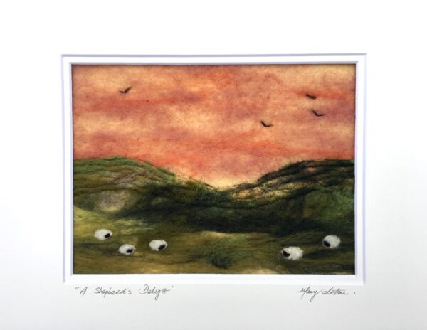 textile art of red sunset and sheep under green hills