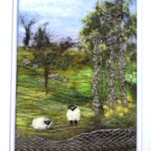 Spring in the fields with sheep under the trees.