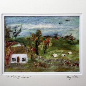 Autumn in Ireland with a traditional cottage and sheep. colours of gold and green.